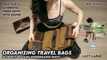 Organizing travel bags in sports bra and windbreaker pants