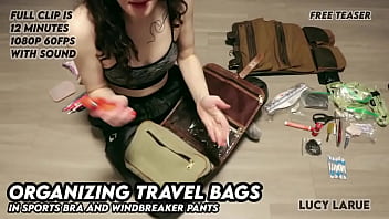 Organizing travel bags in sports bra and windbreaker pants