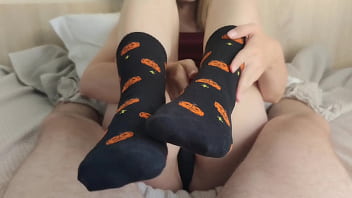 Footjob in black halloween socks