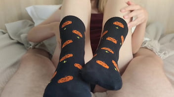 Footjob in black halloween socks