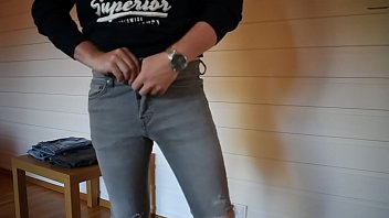 Trying on tight jeans