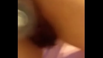 Amateur latina shakes ass with bottle in pussy