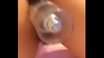 Amateur latina shakes ass with bottle in pussy