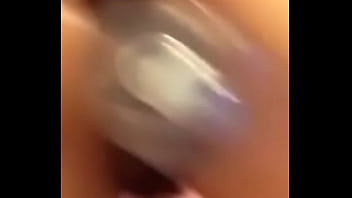 Amateur latina shakes ass with bottle in pussy