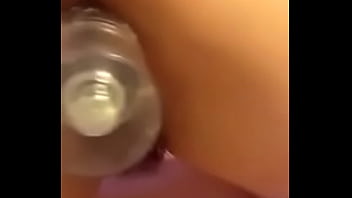 Amateur latina shakes ass with bottle in pussy