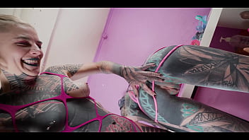 Tattooed babe goes hard with the strap until the inked slut squirts