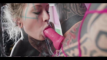 Tattooed babe goes hard with the strap until the inked slut squirts