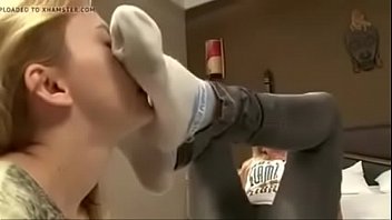 Chick smells her friends' socked feet