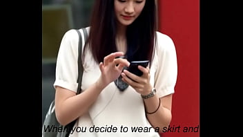 Attractive chinese looking woman got upskirt by the wind