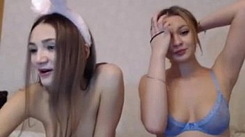 Two cute girl in front cam kissing