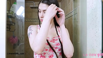 Elegant brunette beauty enjoys a sensual bath