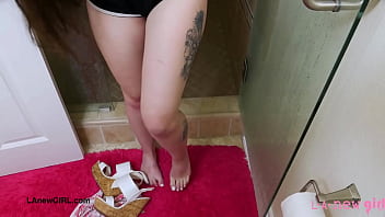 Elegant brunette beauty enjoys a sensual bath