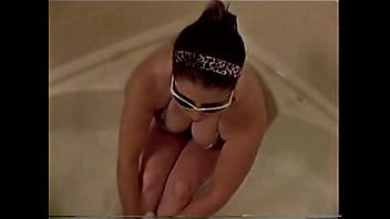 Busty college brunette plays in the tub