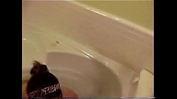 Busty college brunette plays in the tub
