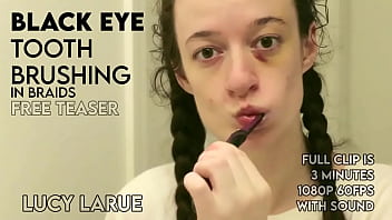 Black eye tooth brushing in braids