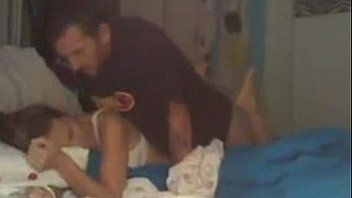 Hot amateur couple having sex on bed in front of camera