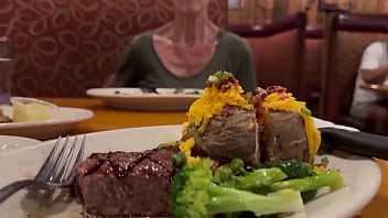 Sharing a steak and loaded baked potato with my photographer and a little more