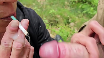 Smoking two cigarettes and give him blow job with cumshoot on my face when i smoked