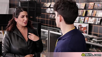 Busty housewife fucked in the video store Busty housewife fucked in the video store