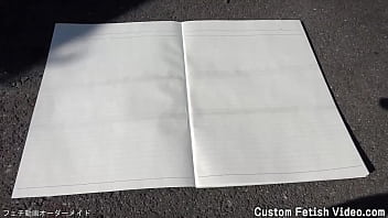 Print the traces of a girl's bicycle tire on a notebook