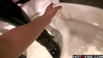 Rocker chick fingering both her holes