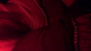 Masked in the red light sucking cock