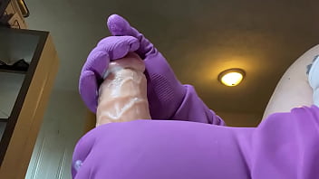 Stroking that hard cock in gloves