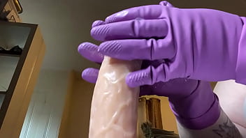 Stroking that hard cock in gloves