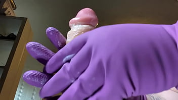 Stroking that hard cock in gloves