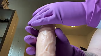 Stroking that hard cock in gloves