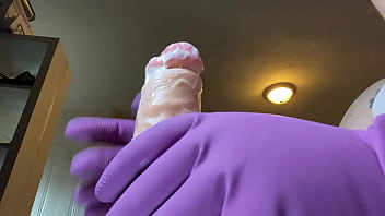 Stroking that hard cock in gloves