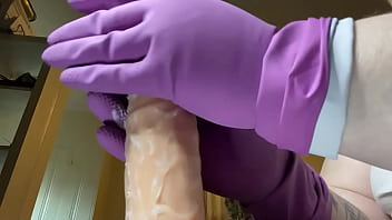 Stroking that hard cock in gloves