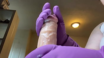 Stroking that hard cock in gloves