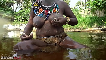 Big tittie zulu aunty washing herself in a tropical forrest river