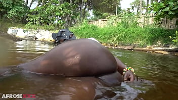 Big tittie zulu aunty washing herself in a tropical forrest river