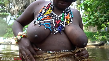 Big tittie zulu aunty washing herself in a tropical forrest river