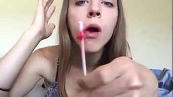 Beauty sucking and slurping lollipop and chewing gum
