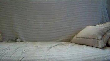 Small tits fingering herself