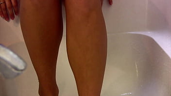 Teasing you with my feet in the bathtub