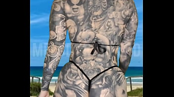 Milf micro bikini modelling on the beach