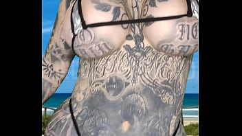 Milf micro bikini modelling on the beach