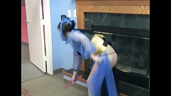 Horny brunette moans while masturbating near the fireplace