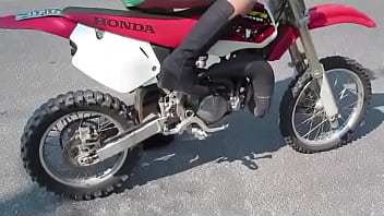 Girl revving a dirtbike