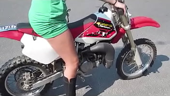 Girl revving a dirtbike