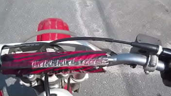 Girl revving a dirtbike