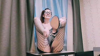 An aunt with glasses and fishnet tights is flirting with you