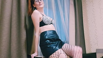 An aunt with glasses and fishnet tights is flirting with you