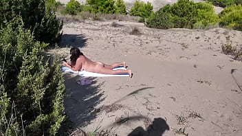 Stranger on a nudist beach