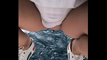 Arielarider public pissing from a boat into the sea