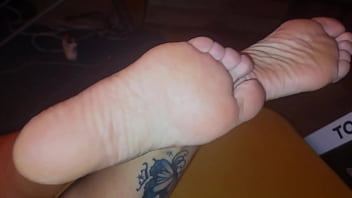 The stepmother allowed the stepson to watch as she lubricates her feet with cream